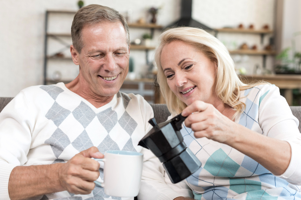 Mature couple laughing together at dinner